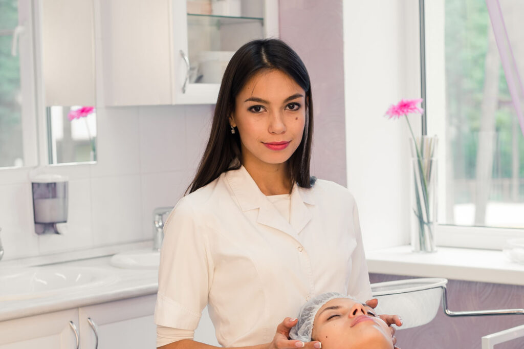 woman cosmetologist to work in beauty salon PXUH8BP